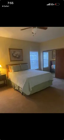 a view of a swimming pool with an outdoor seating