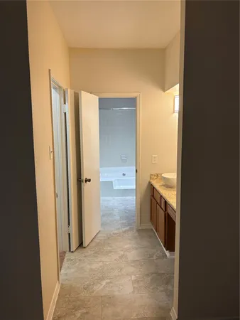 a view of a kitchen from the hallway