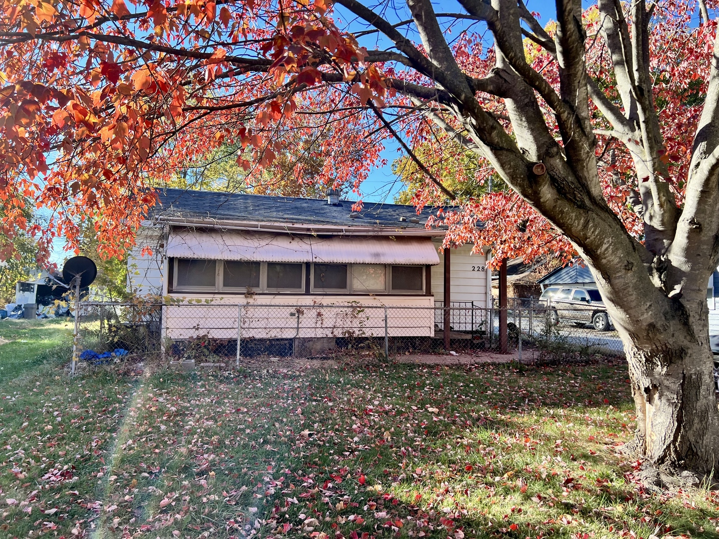 228 Tennessee Avenue Danville, IL 61832 - Photo 1 of 19 a front view of a house with a yard