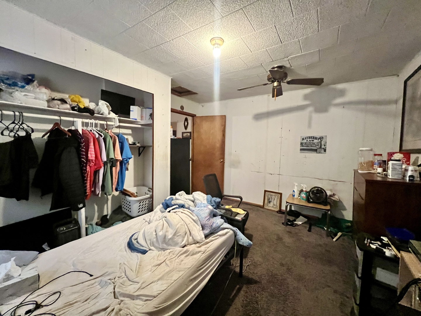 228 Tennessee Avenue Danville, IL 61832 - Photo 14 of 19 a bedroom with a bed and a walk in closet