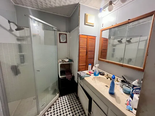 a bathroom with a sink and a mirror