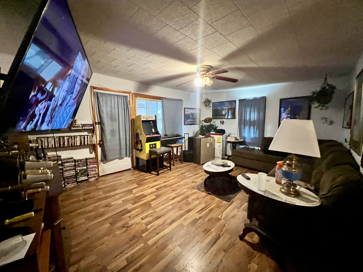 228 Tennessee Avenue Danville, IL 61832 - Photo 3 of 19 a living room with furniture a rug and a chandelier