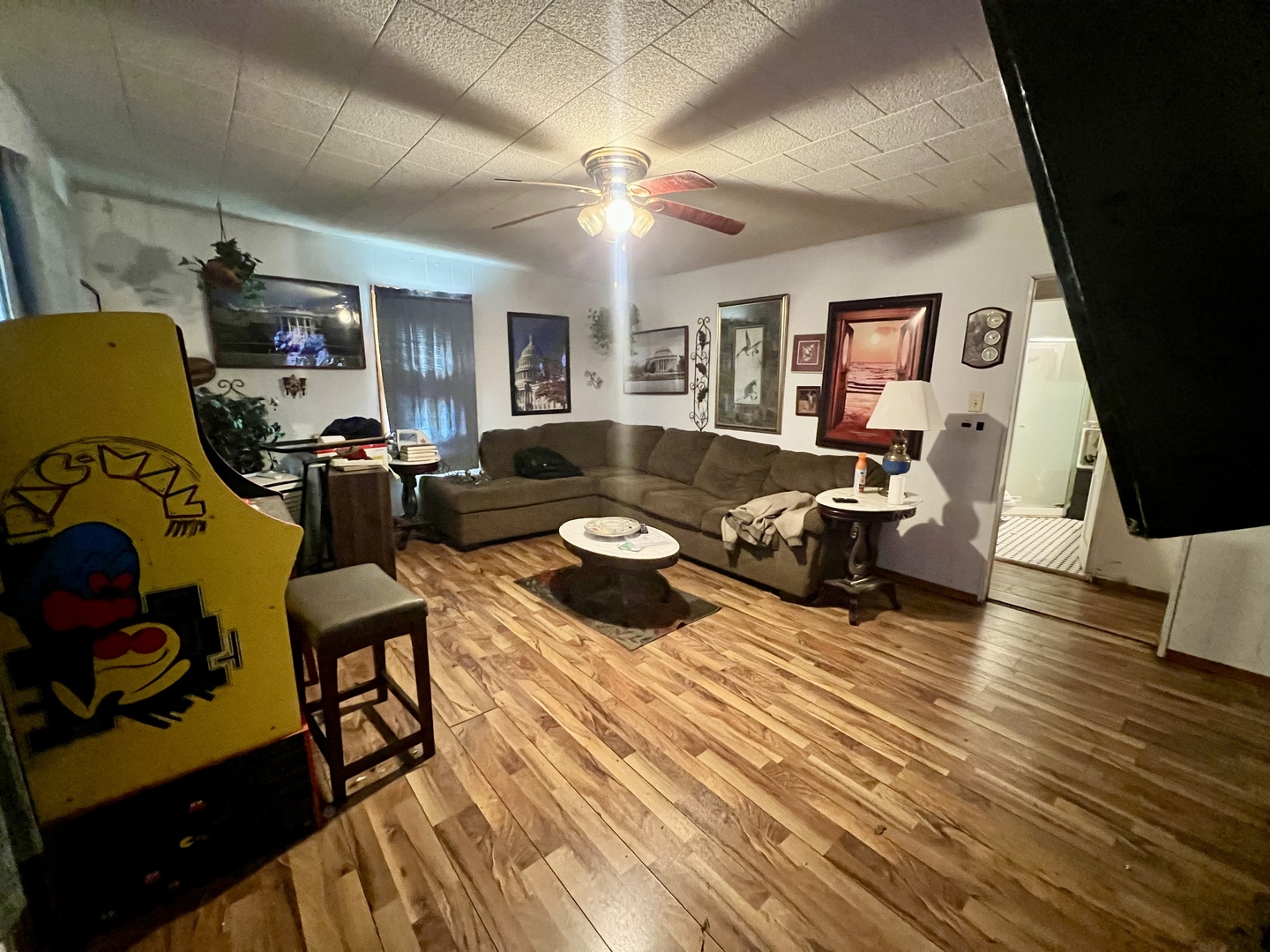 228 Tennessee Avenue Danville, IL 61832 - Photo 4 of 19 a living room with furniture and a flat screen tv