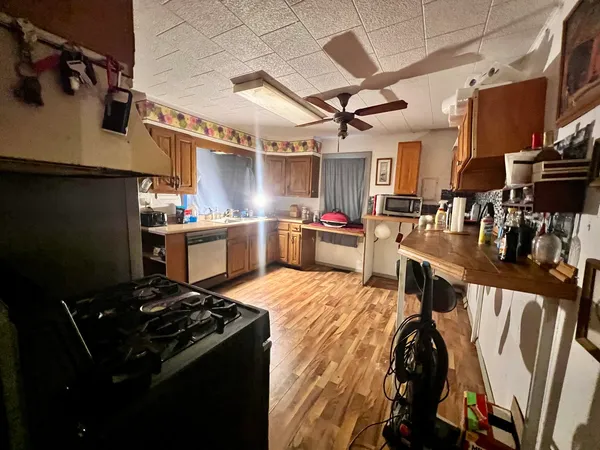 a kitchen with stainless steel appliances granite countertop a stove and a refrigerator