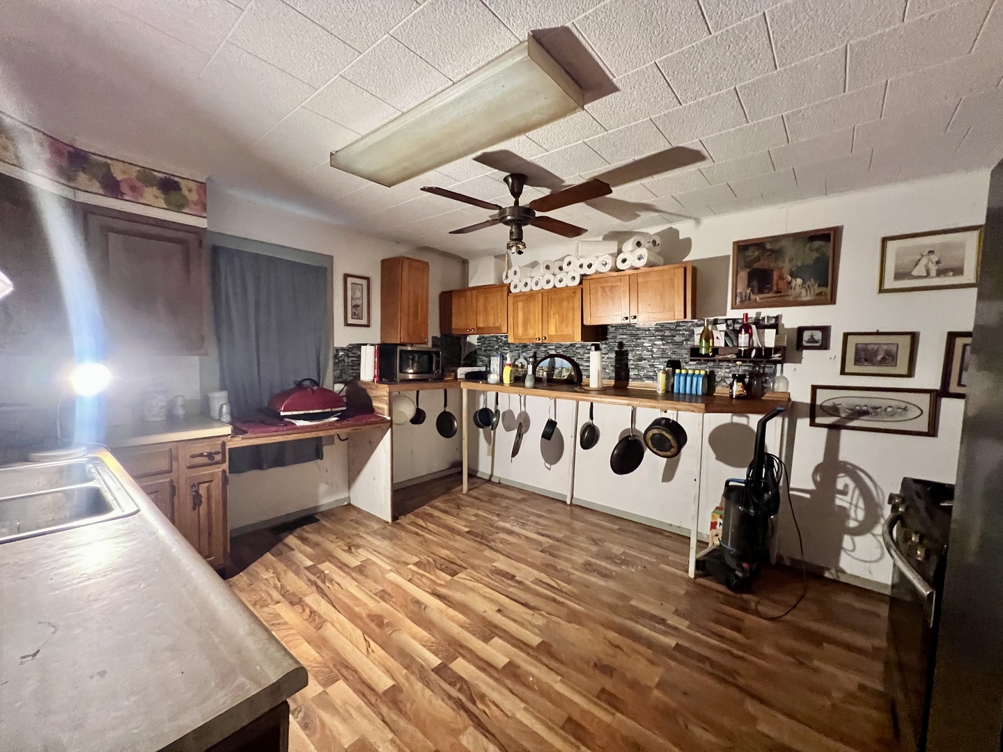 228 Tennessee Avenue Danville, IL 61832 - Photo 7 of 19 a living room with lots of furniture and a kitchen view