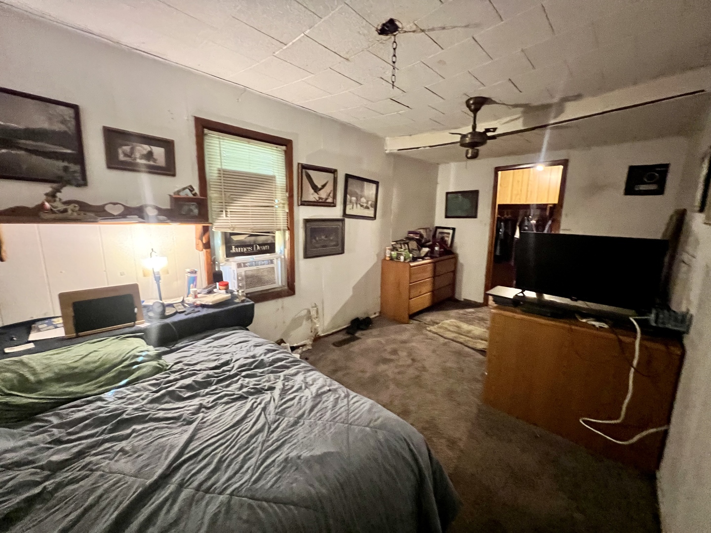 228 Tennessee Avenue Danville, IL 61832 - Photo 10 of 19 a bedroom with a bed window and couch