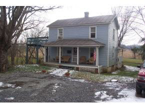 1389 Dam Town Road Fort Defiance, VA 24437 - Photo 1 of 1 a front view of a house with a garden