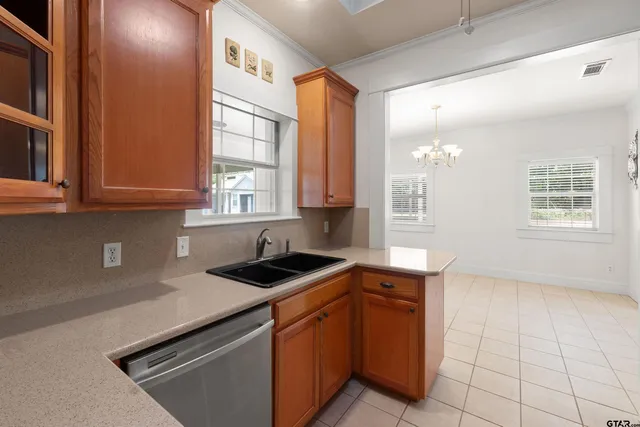 a kitchen that has a sink and a stove