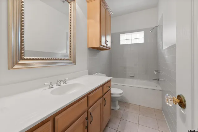 a bathroom with a sink a toilet and a bathtub