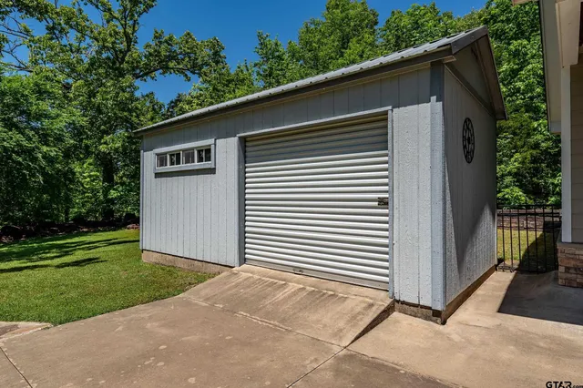 a side view of a house with a yard