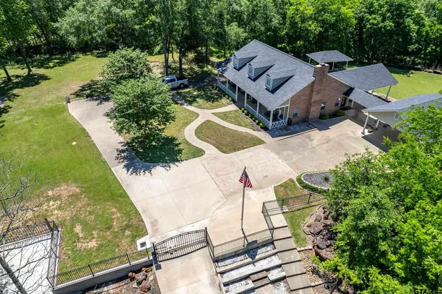 an aerial view of a house with a swimming pool