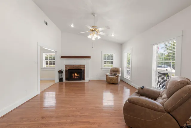 a living room with furniture and a fireplace