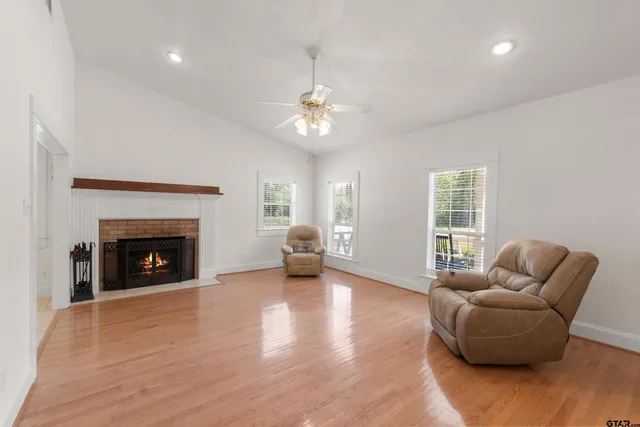 a living room with furniture and a fireplace