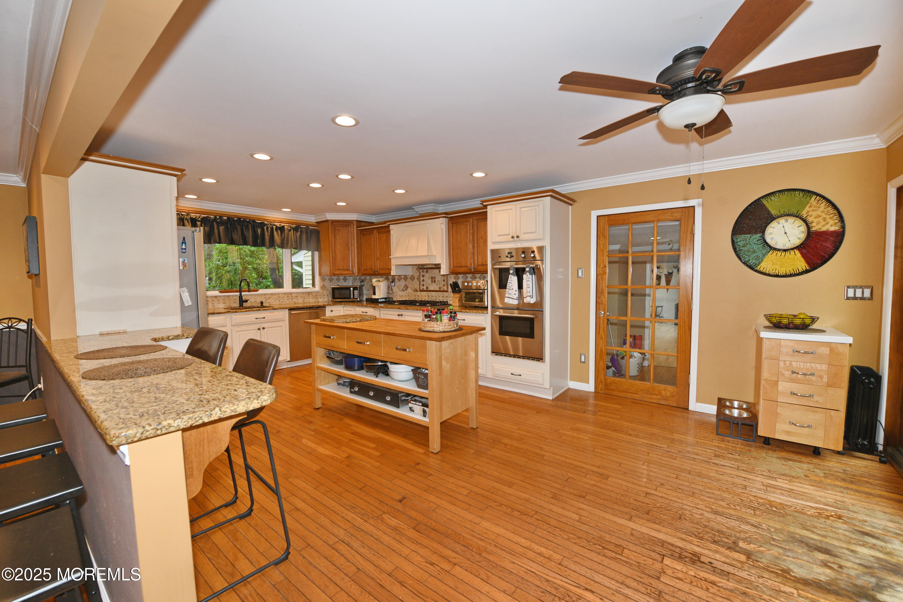 17 High Point Road Lincroft, NJ 07738 - Photo 20 of 39 a living room with stainless steel appliances kitchen island granite countertop furniture and a kitchen view