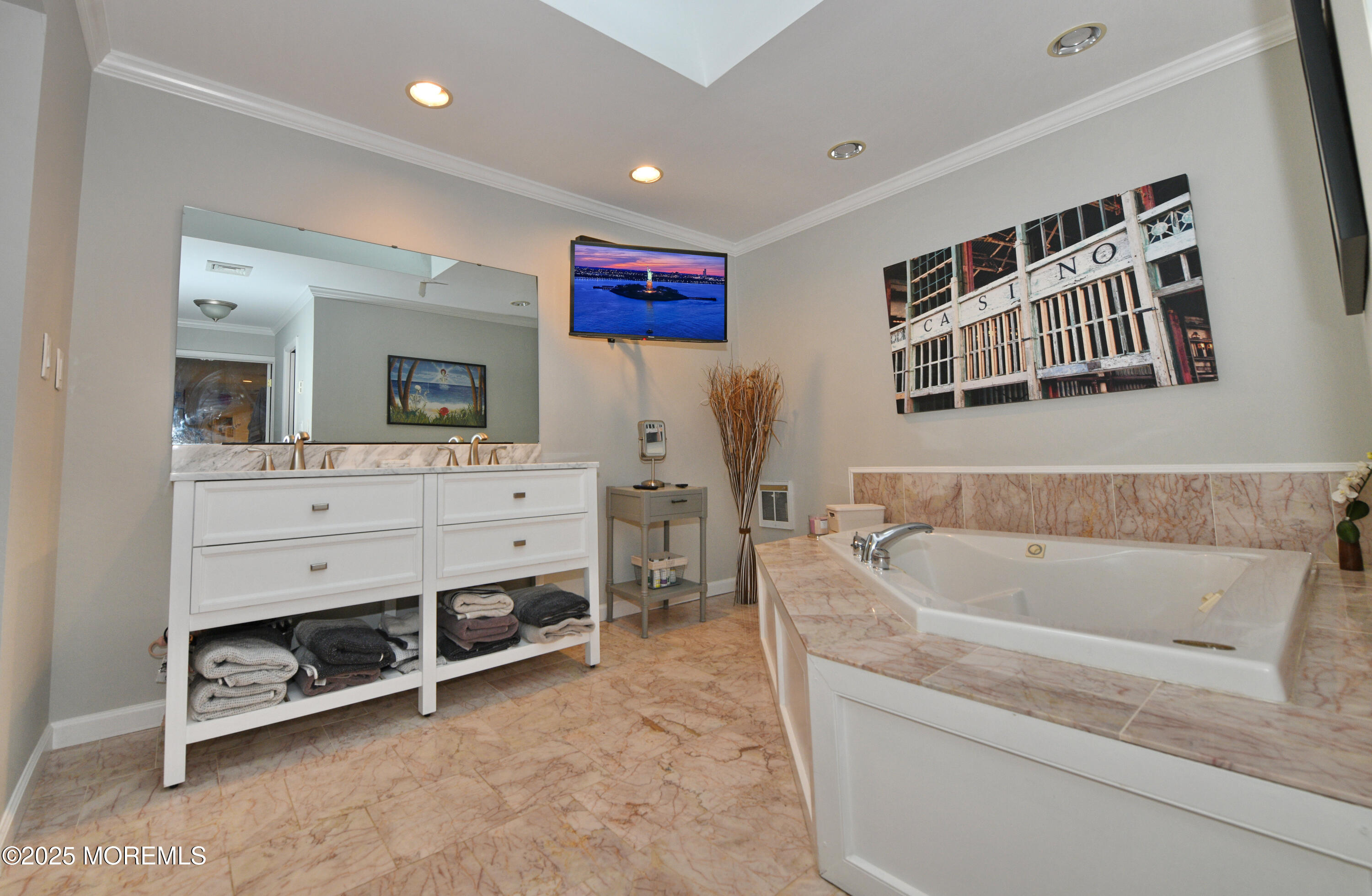 17 High Point Road Lincroft, NJ 07738 - Photo 26 of 39 a bathroom with a bathtub a sink and a mirror