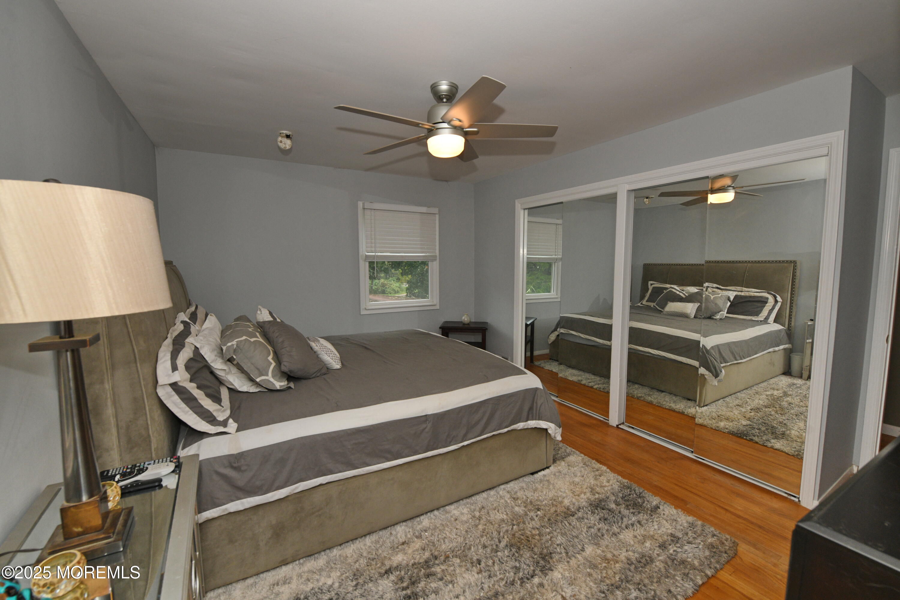 17 High Point Road Lincroft, NJ 07738 - Photo 28 of 39 a bedroom with a bed and a lamp on table