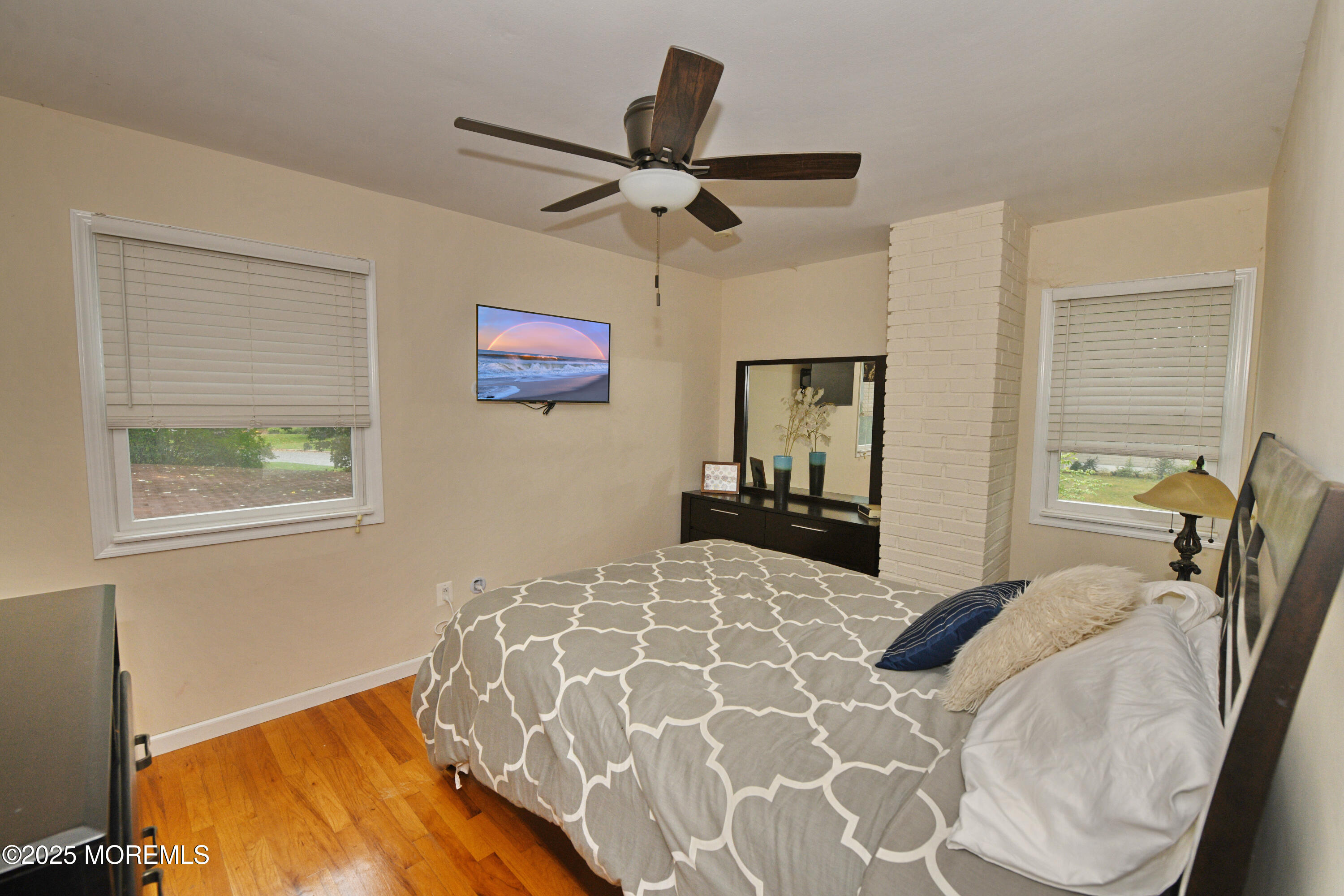 17 High Point Road Lincroft, NJ 07738 - Photo 32 of 39 a bedroom with a bed and wooden floor