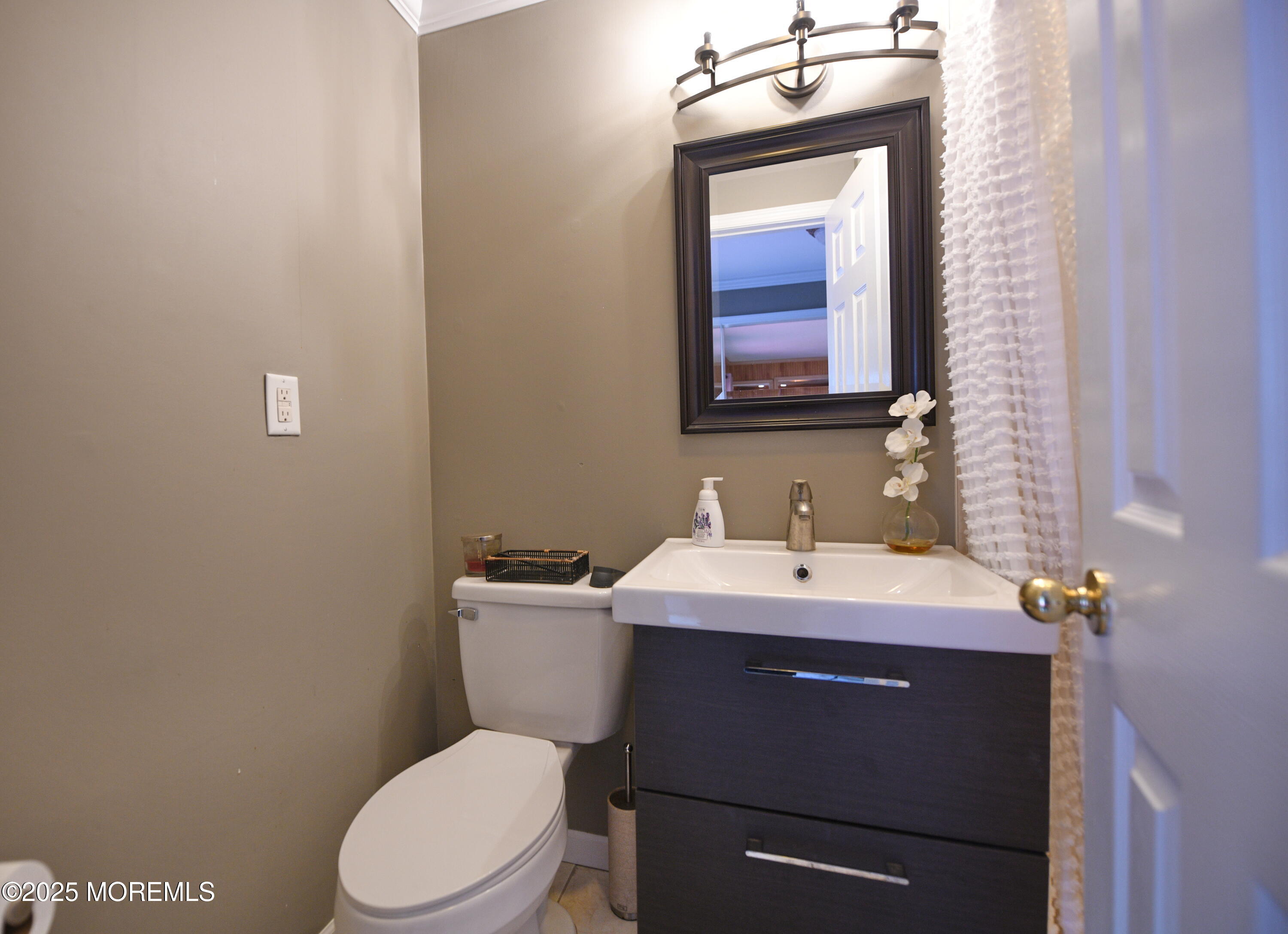 17 High Point Road Lincroft, NJ 07738 - Photo 39 of 39 a bathroom with a toilet sink and mirror
