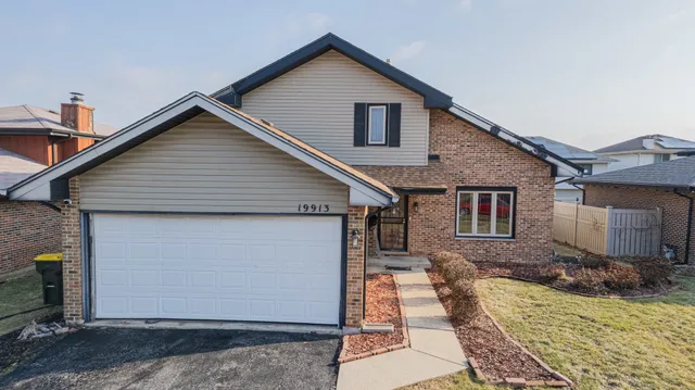 a front view of a house with yard