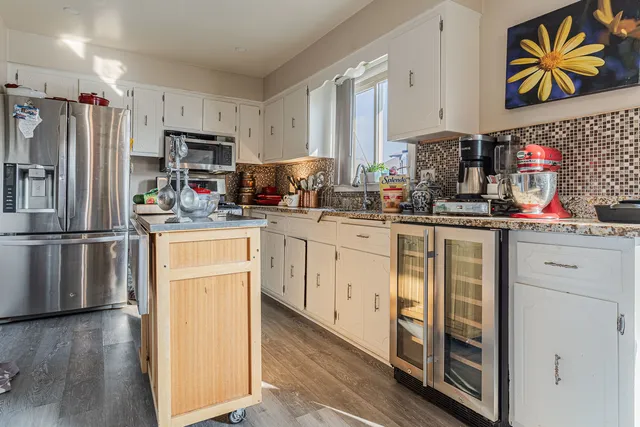 a kitchen with a sink and cabinets