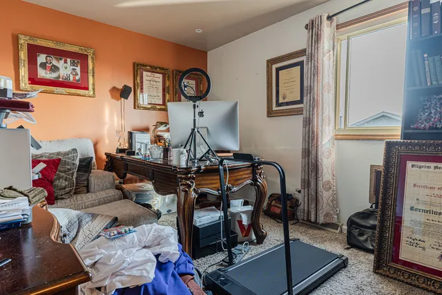 a bedroom with a bed and a dresser