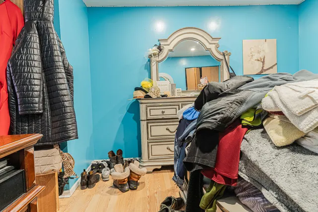 a bedroom with a bed and flat screen tv