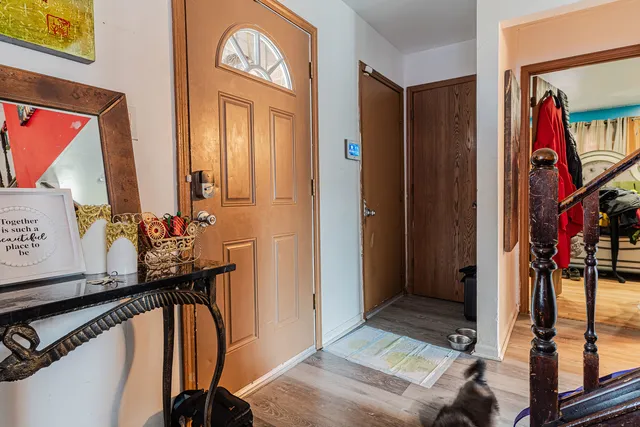 a view of an entryway with a mirror