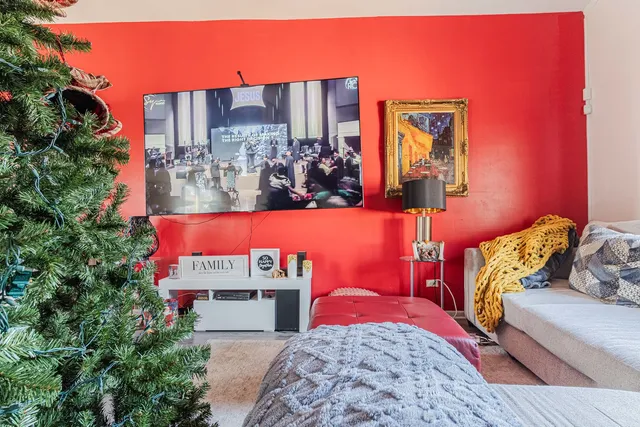 a view of a patio with table and chairs and potted plants