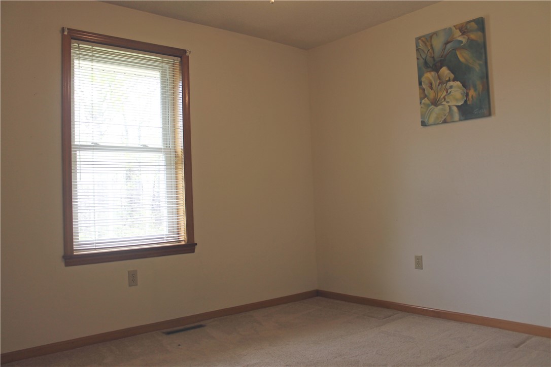 1007 O Neal Street Belton, SC 29627 - Photo 14 of 25 Bright windows frame this inviting space, offering a serene backdrop for daily living.