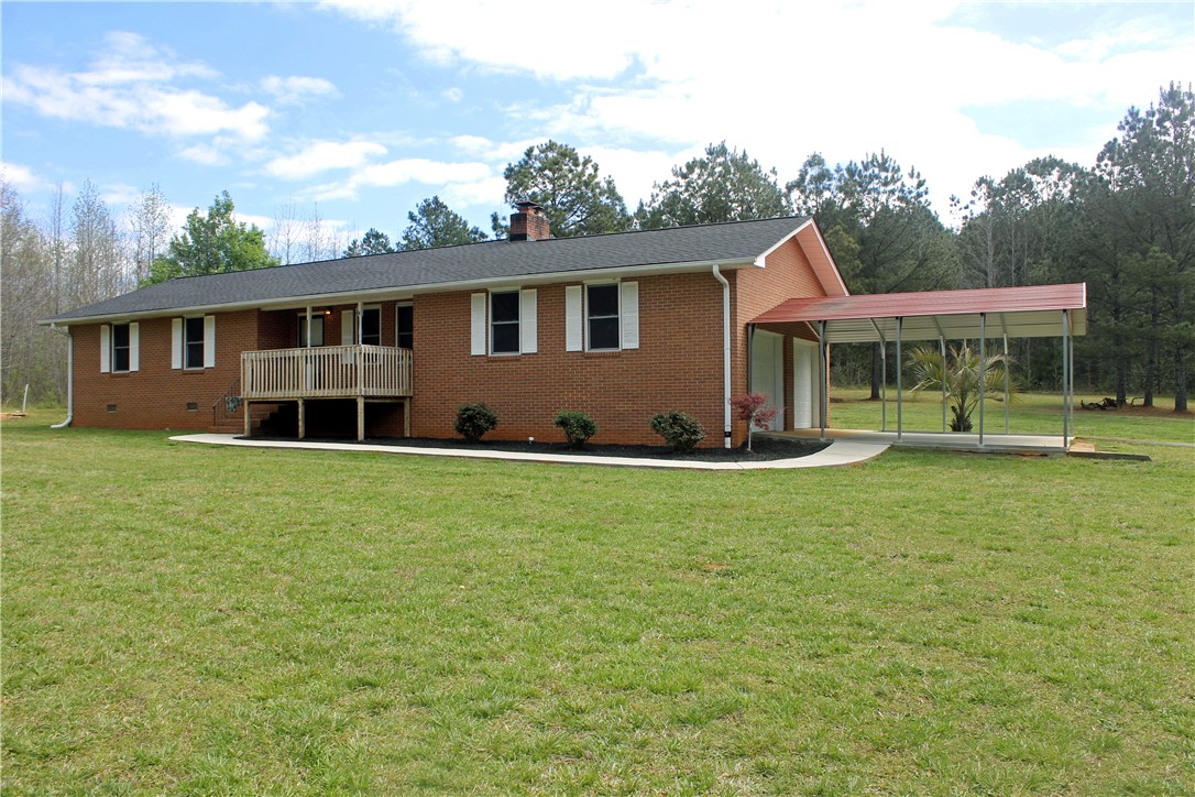 1007 O Neal Street Belton, SC 29627 - Photo 15 of 25 This classic brick residence features a welcoming front porch and a convenient carport.