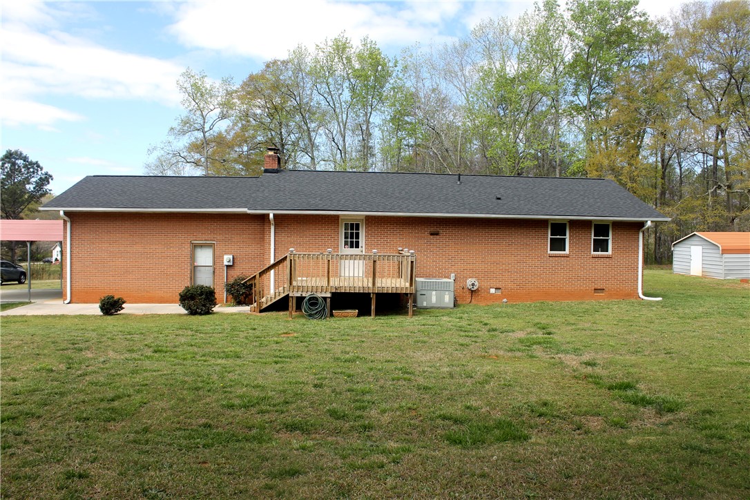 1007 O Neal Street Belton, SC 29627 - Photo 19 of 25 This spacious property features a durable brick exterior, a private deck, and ample outdoor storage.