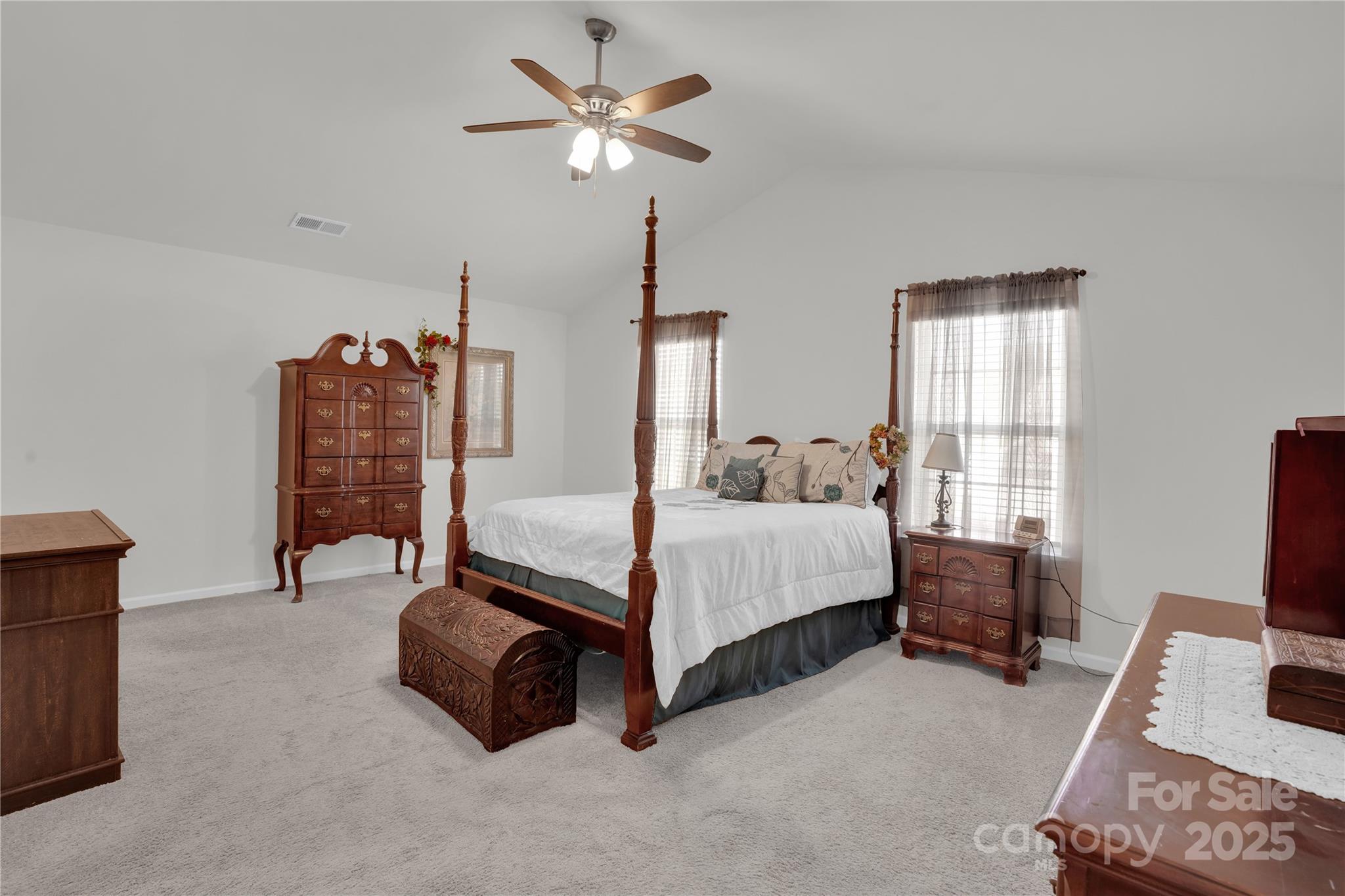 4918 Traynor Road Charlotte, NC 28216 - Photo 11 of 27 a bedroom with a bed and a chandelier