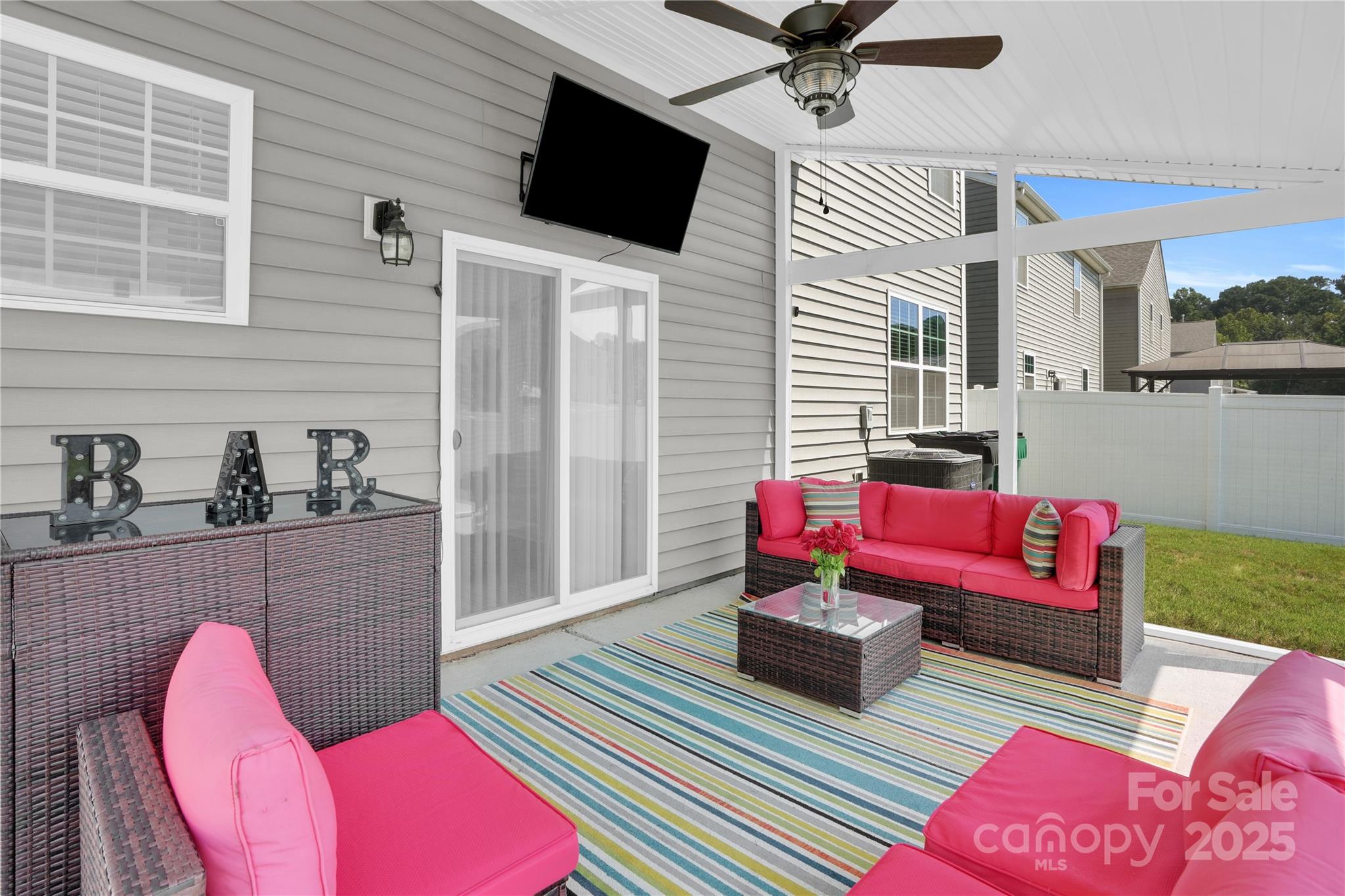 4918 Traynor Road Charlotte, NC 28216 - Photo 23 of 27 a living room with furniture and a rug