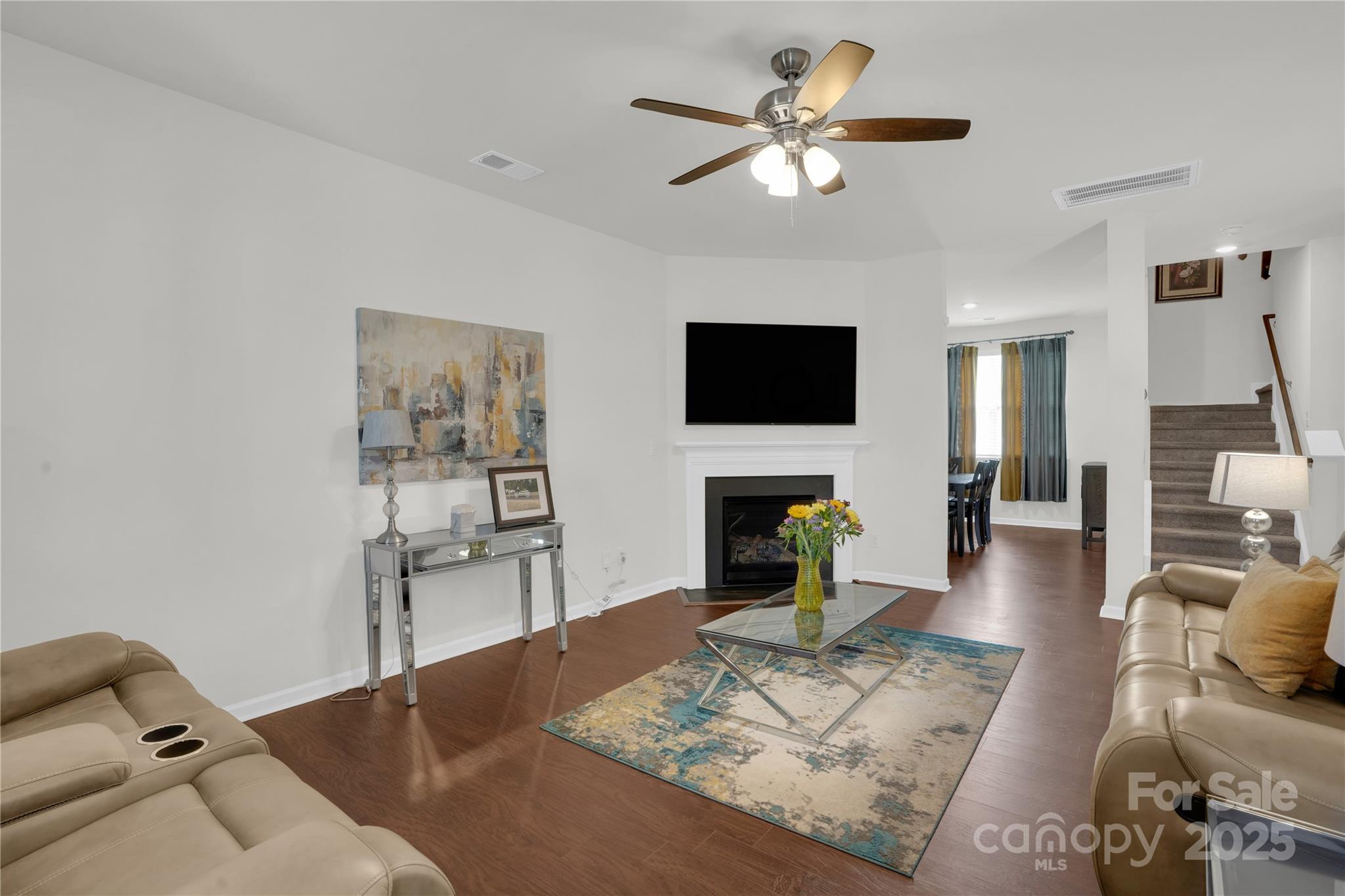 4918 Traynor Road Charlotte, NC 28216 - Photo 6 of 27 a living room with furniture a fireplace and a flat screen tv