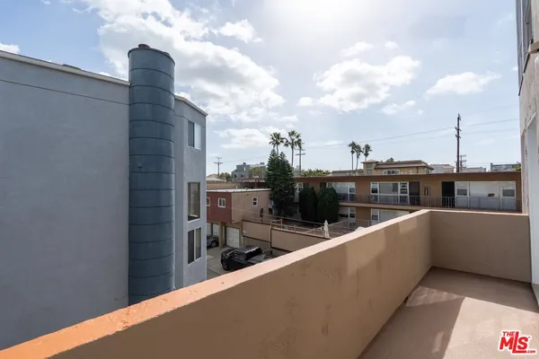 a view of a balcony with city view