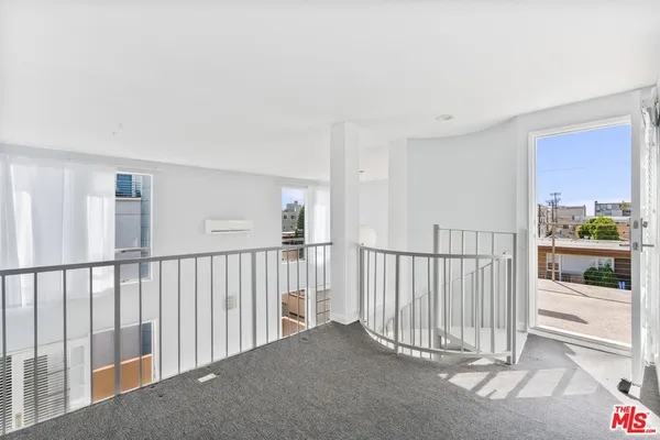 a view of a hallway with a staircase