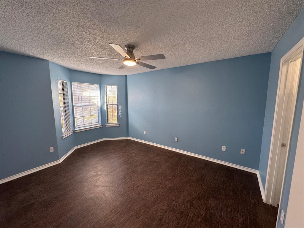 6259 Canyon Circle Fort Worth, TX 76133 - Photo 13 of 22 wooden floor in an empty room with a window