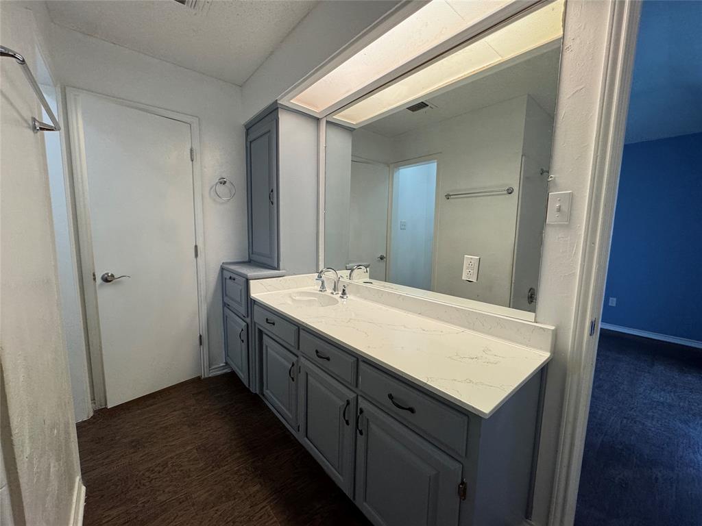 6259 Canyon Circle Fort Worth, TX 76133 - Photo 20 of 22 a bathroom with a granite countertop sink and a mirror