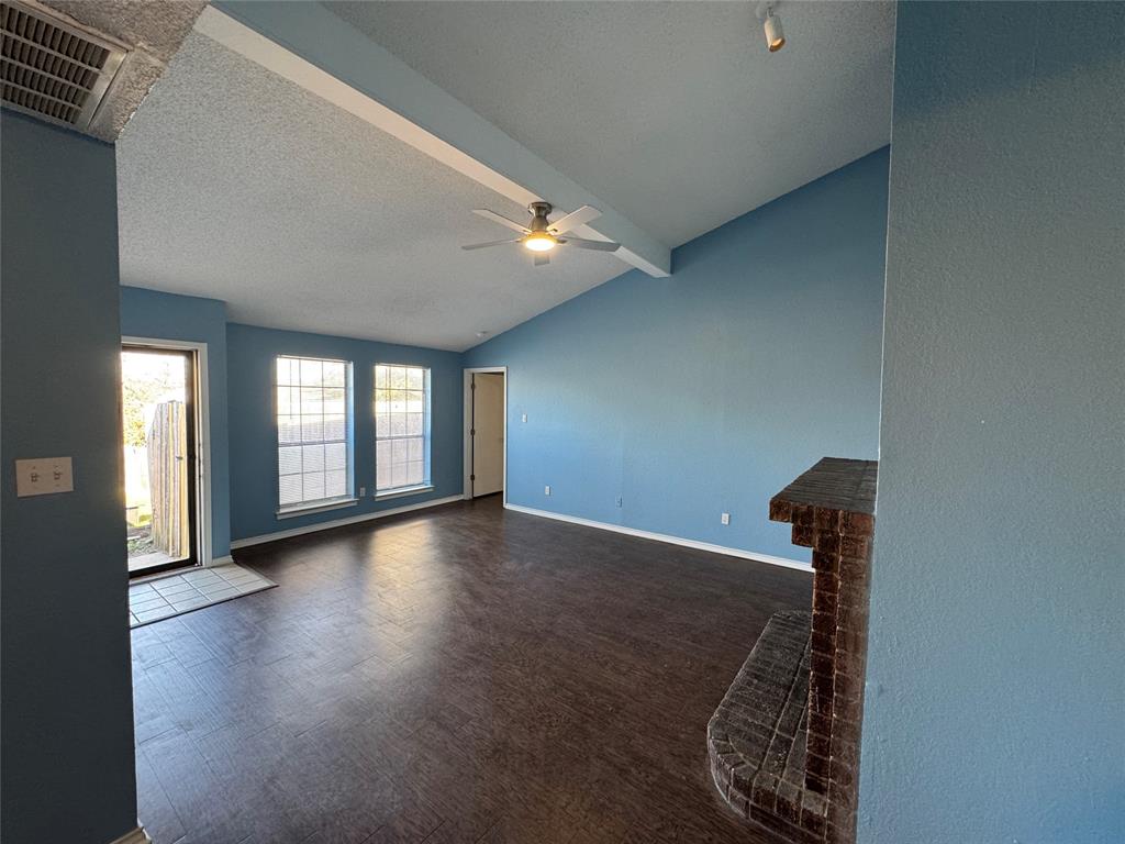 6259 Canyon Circle Fort Worth, TX 76133 - Photo 7 of 22 a view of a livingroom with wooden floor and a staircase