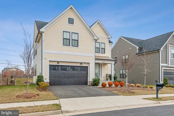 a front view of a house with garage
