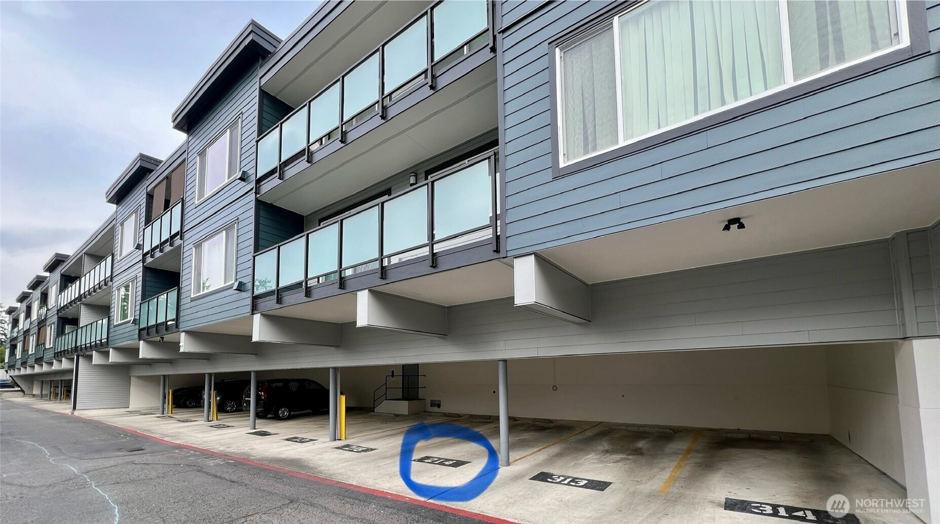 1175 Harrington Place Northeast, Unit 214 Renton, WA 98056 - Photo 3 of 16 a view of a house with a door and balcony