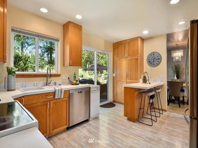 a large kitchen with a large window