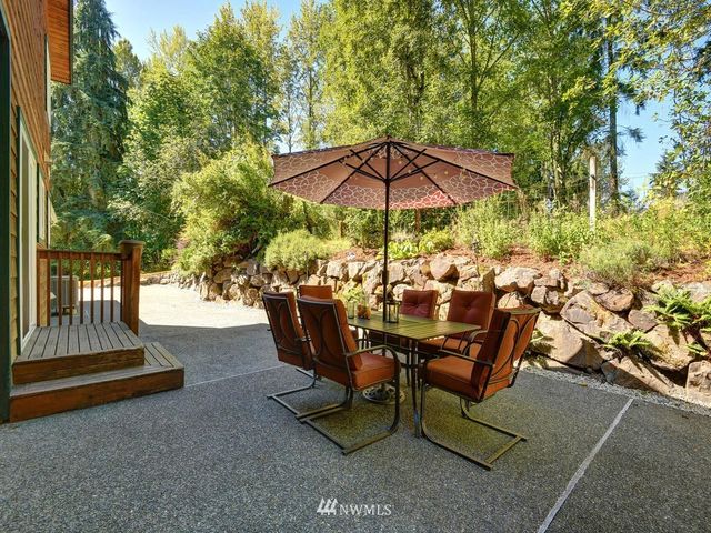 an outdoor space with furniture and umbrella