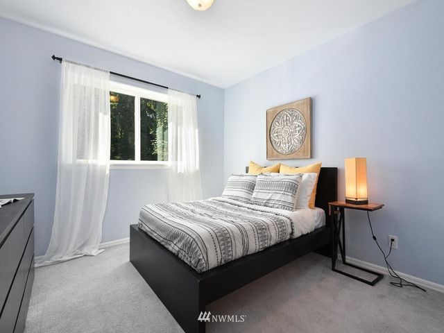 a bedroom with bed and window