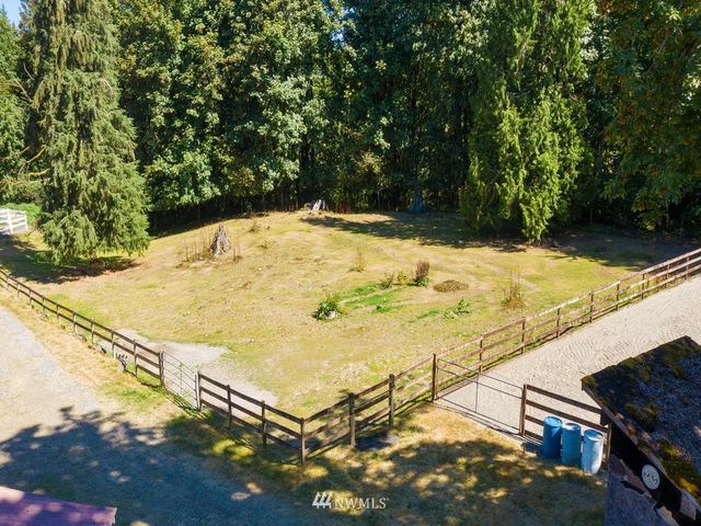 a view of a swimming pool with a yard