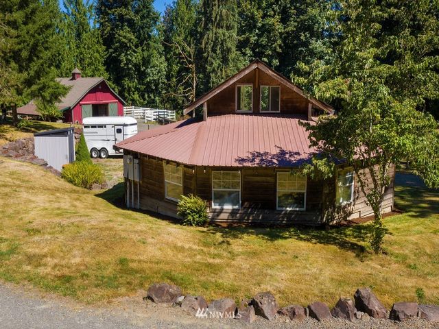 a view of house with yard