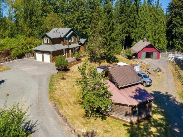 an aerial view of a house with swimming pool