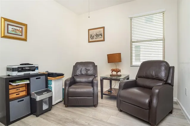 a living room with furniture and a window