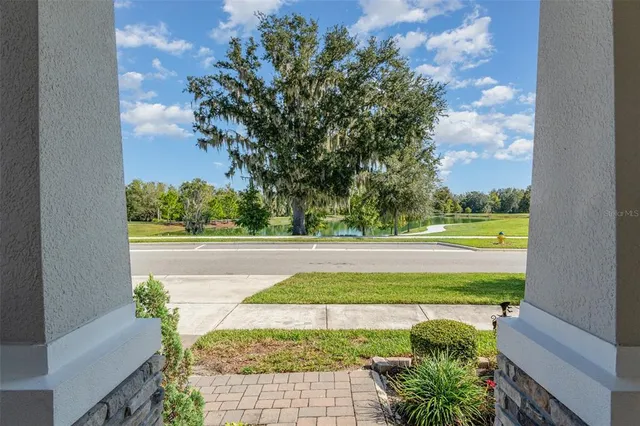 a view of a yard with an outdoor seating
