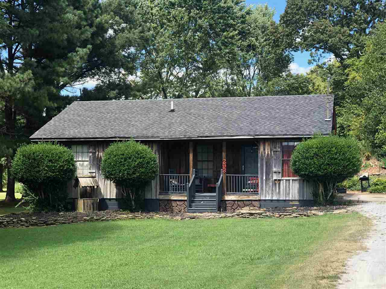 293 Caldwell Road Jackson, TN 38301 - Photo 1 of 1 a view of a house with a garden and plants